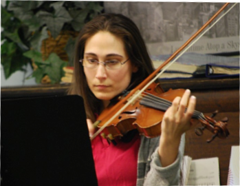 Kristin playing the violin in performance